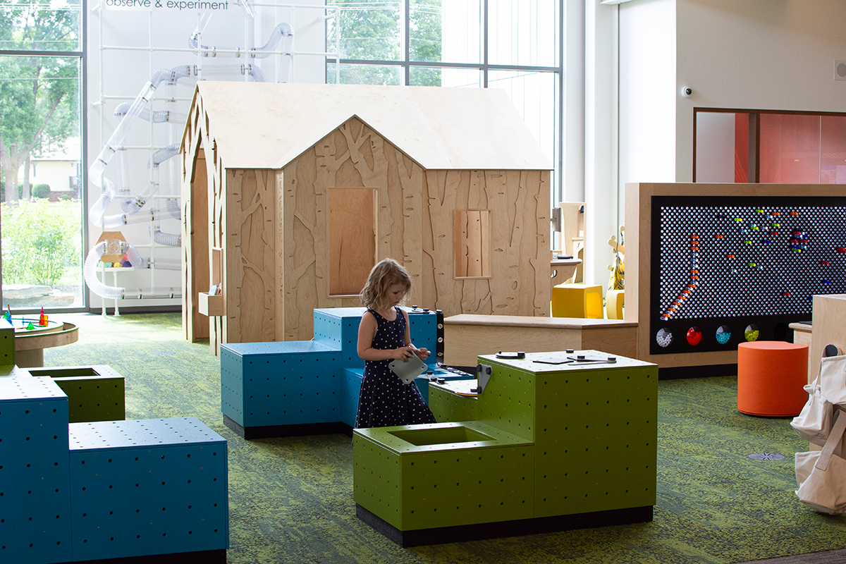 girl playing with engineering blocks